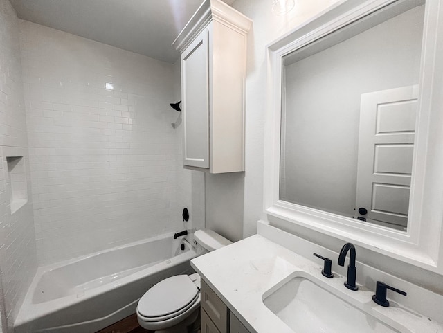 bathroom featuring toilet, bathtub / shower combination, and vanity