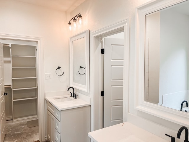 bathroom featuring concrete floors and vanity