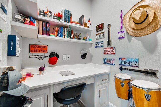 home office featuring built in study area