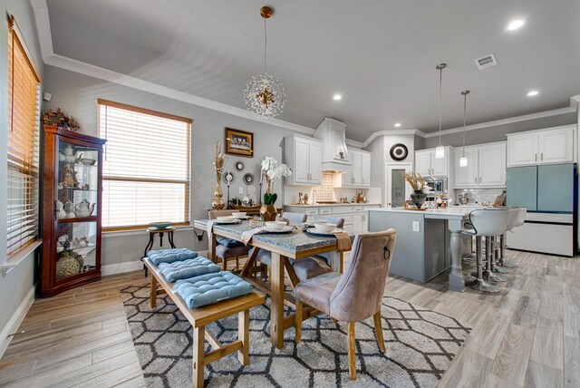 13 La Cresta Ave, Odessa, TX 79765 - dining space with ornamental molding, light wood-style flooring, baseboards, and recessed lighting