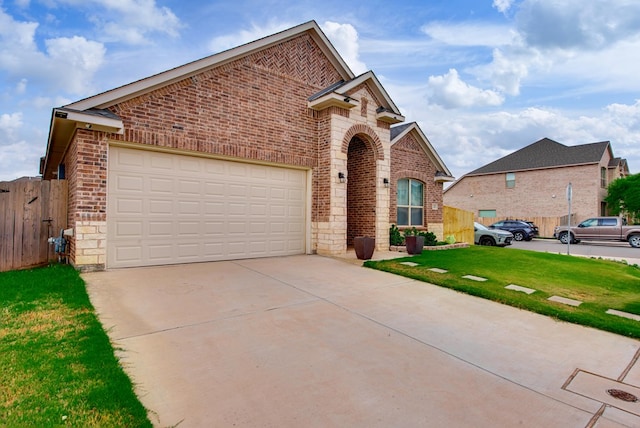 13 La Cresta Ave, Odessa, TX 79765 - traditional-style home with brick siding, concrete driveway, and a garage