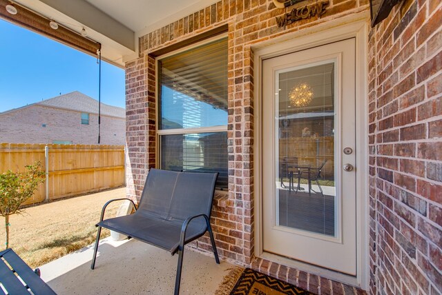 view of patio featuring fence