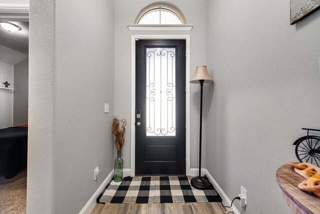 13 La Cresta Ave, Odessa, TX 79765 - entrance foyer featuring wood finished floors and baseboards