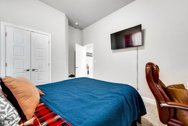 carpeted bedroom featuring baseboards