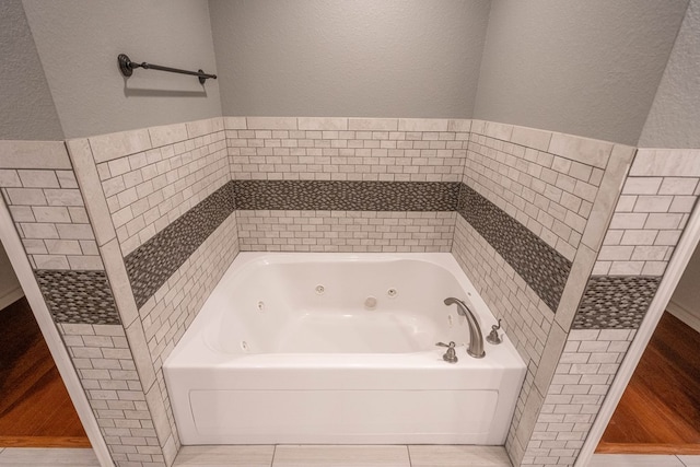 bathroom featuring a tub to relax in