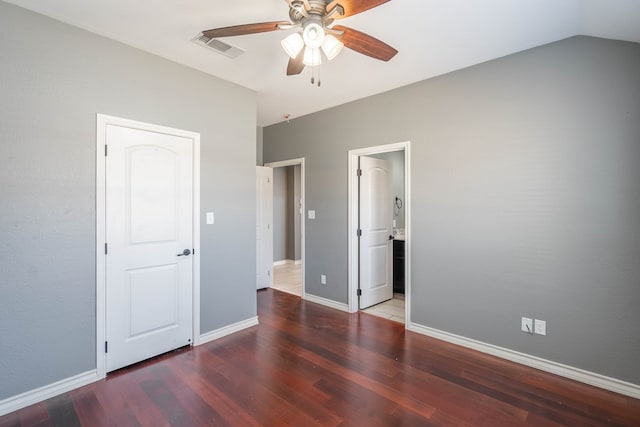 unfurnished bedroom featuring ceiling fan, connected bathroom, and dark hardwood / wood-style flooring