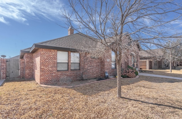 view of property exterior featuring a yard