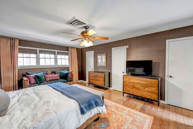 bedroom with ceiling fan and light wood-type flooring