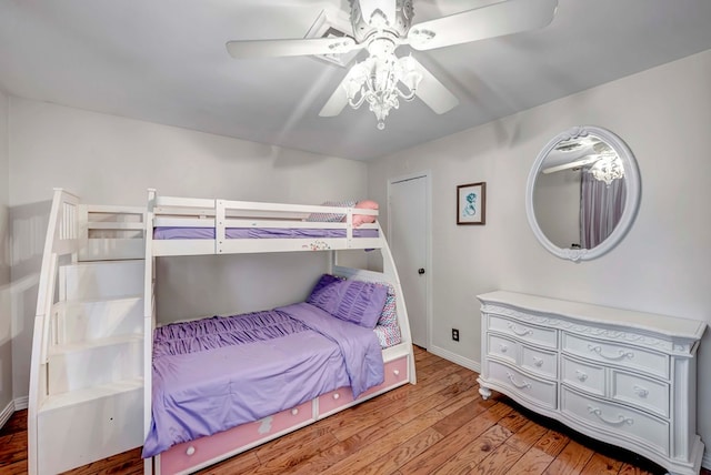 bedroom featuring hardwood / wood-style flooring and ceiling fan