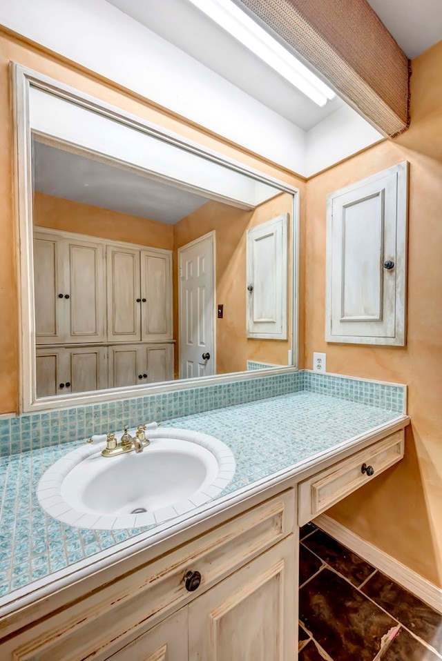 bathroom with tile patterned floors and vanity