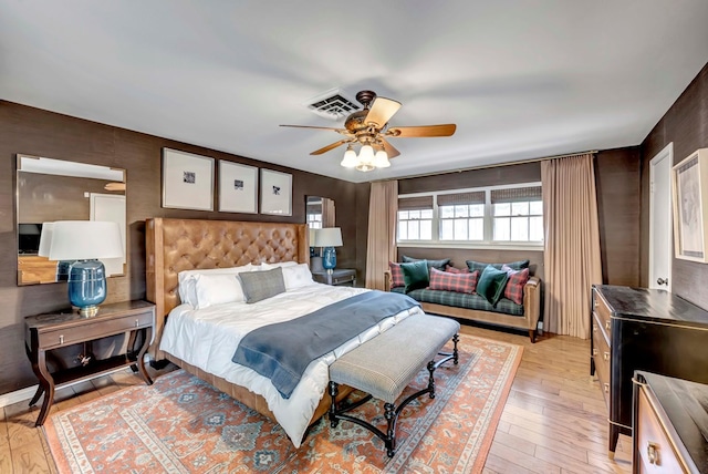 bedroom with ceiling fan and light wood-type flooring