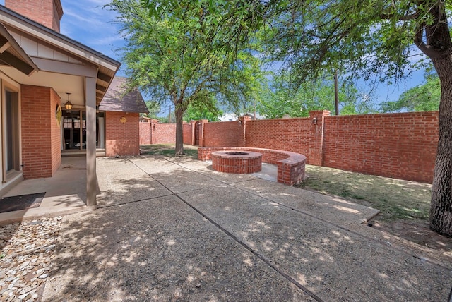 view of patio / terrace featuring an outdoor fire pit