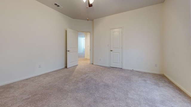 carpeted empty room with ceiling fan