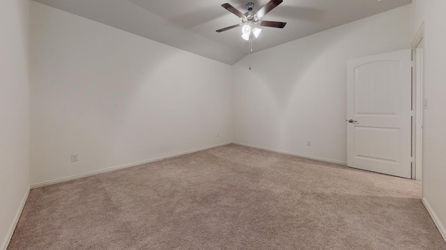 unfurnished room featuring lofted ceiling, light colored carpet, and ceiling fan