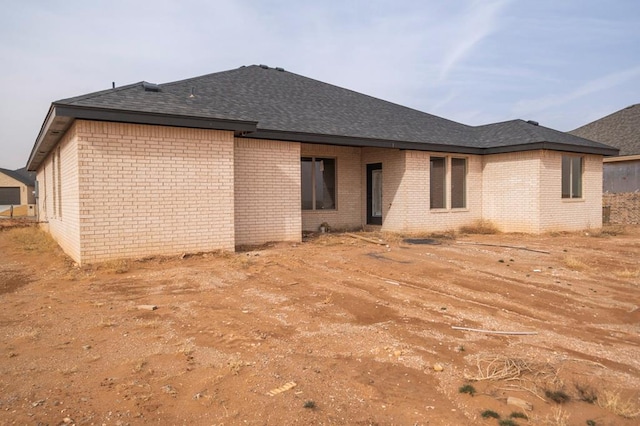 2201 S County Rd 1059, Midland, TX 79706 - rear view of house featuring brick siding and a shingled roof