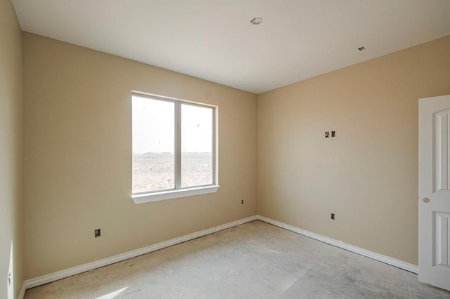 2201 S County Rd 1059, Midland, TX 79706 - spare room featuring baseboards and concrete floors