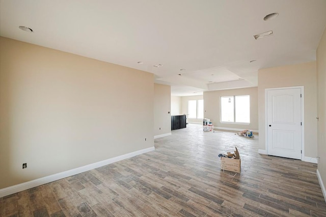 2201 S County Rd 1059, Midland, TX 79706 - unfurnished living room with baseboards and wood finished floors