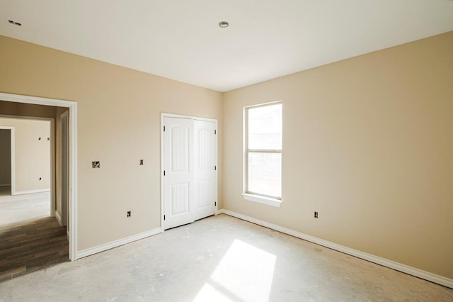 2201 S County Rd 1059, Midland, TX 79706 - unfurnished bedroom featuring baseboards and concrete flooring