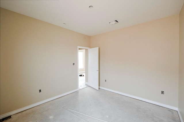 2201 S County Rd 1059, Midland, TX 79706 - unfurnished room with baseboards and concrete flooring