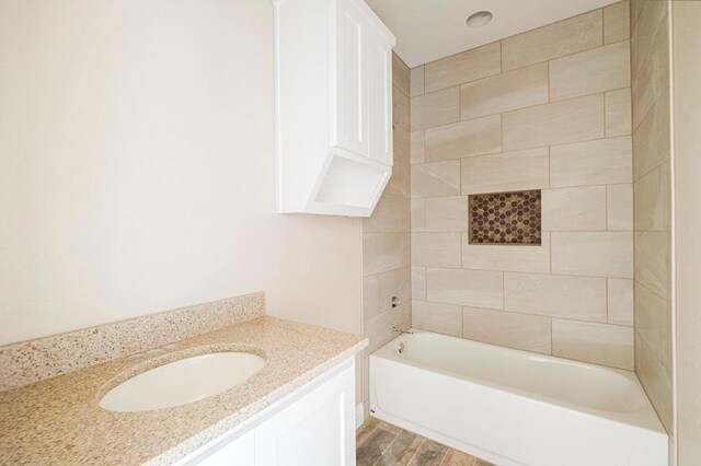 2201 S County Rd 1059, Midland, TX 79706 - full bathroom with shower / bathing tub combination, wood finished floors, and vanity