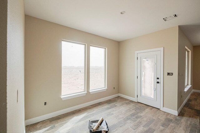 2201 S County Rd 1059, Midland, TX 79706 - entrance foyer featuring light wood finished floors and baseboards