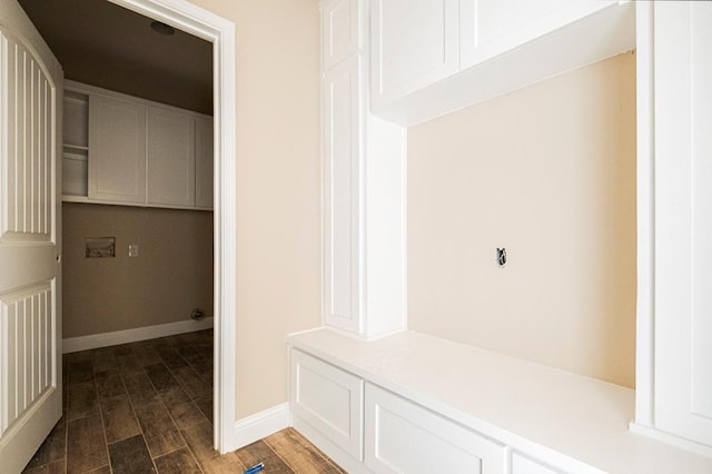 2201 S County Rd 1059, Midland, TX 79706 - mudroom featuring dark wood-style floors and baseboards