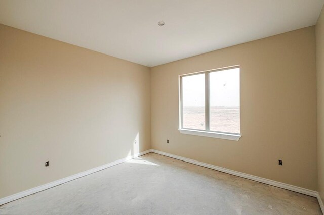 2201 S County Rd 1059, Midland, TX 79706 - unfurnished room featuring concrete flooring and baseboards