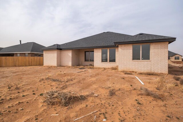 2201 S County Rd 1059, Midland, TX 79706 - back of property featuring brick siding and fence