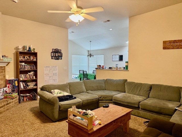 6712 Spur Dr, Midland, TX 79705 - living room featuring a ceiling fan, lofted ceiling, and light carpet
