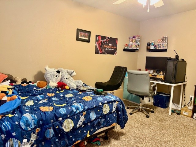 6712 Spur Dr, Midland, TX 79705 - bedroom featuring carpet floors and a ceiling fan