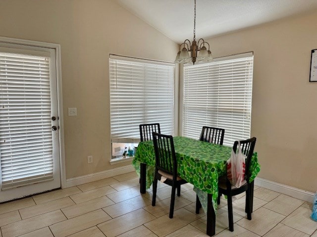 6712 Spur Dr, Midland, TX 79705 - dining room featuring a chandelier and vaulted ceiling