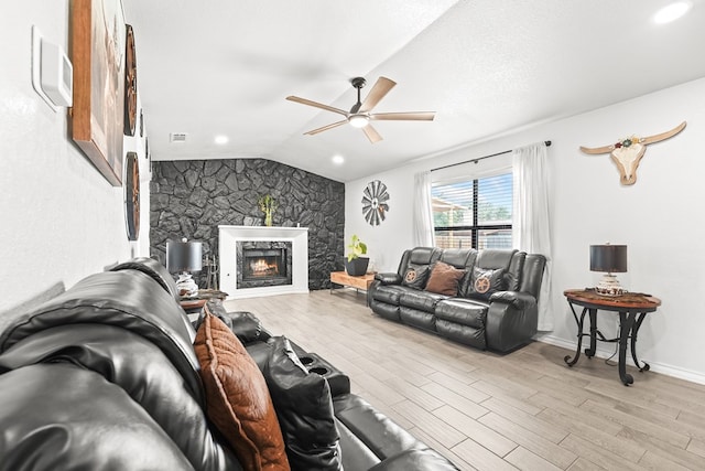 400 Player Ct, Midland, TX 79705 - living area with ceiling fan, light wood-type flooring, vaulted ceiling, and a fireplace