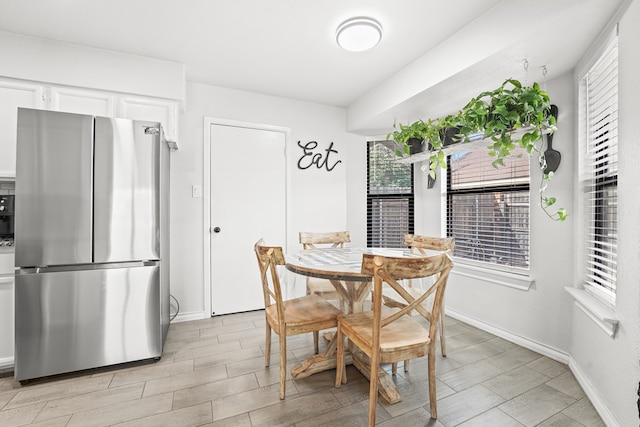 400 Player Ct, Midland, TX 79705 - dining space with baseboards and light wood finished floors