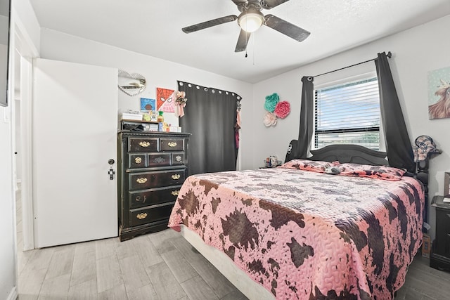 400 Player Ct, Midland, TX 79705 - bedroom with wood finished floors and a ceiling fan