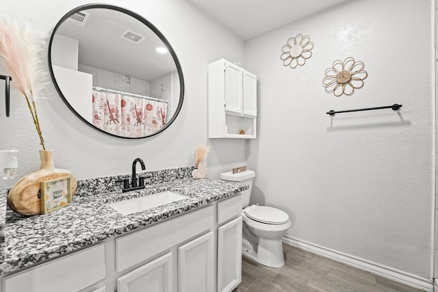 400 Player Ct, Midland, TX 79705 - full bathroom featuring wood finished floors and vanity