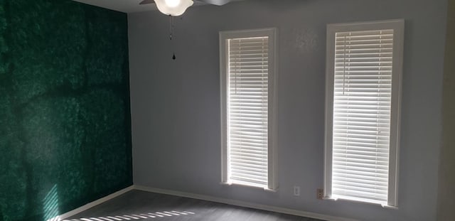 unfurnished room featuring hardwood / wood-style flooring and ceiling fan