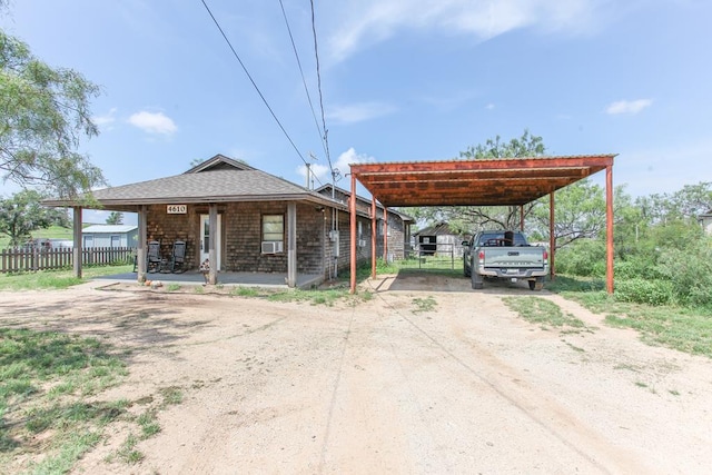 4610 Wasson Rd, Big Spring, TX 79720 - view of vehicle parking featuring driveway and a carport