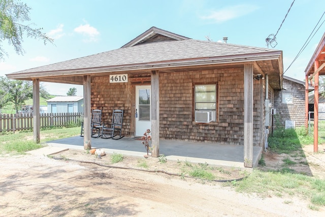 4610 Wasson Rd, Big Spring, TX 79720 - rear view of house with covered porch and a shingled roof