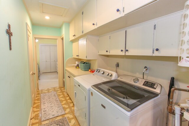 4610 Wasson Rd, Big Spring, TX 79720 - laundry area with cabinet space, washer and dryer, light floors, and attic access