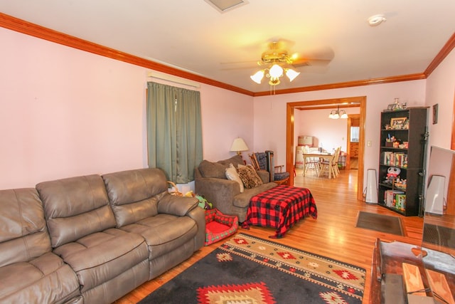 4610 Wasson Rd, Big Spring, TX 79720 - living area featuring wood finished floors, a ceiling fan, and crown molding