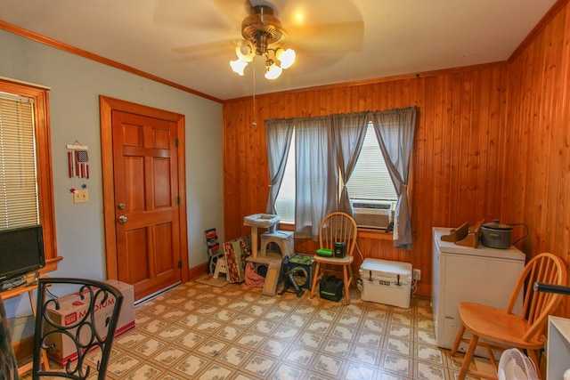 4610 Wasson Rd, Big Spring, TX 79720 - sitting room featuring ceiling fan, light flooring, wood walls, and ornamental molding