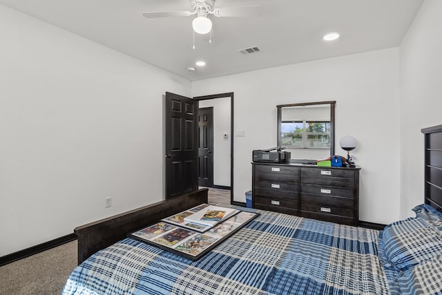 bedroom featuring ceiling fan and dark colored carpet