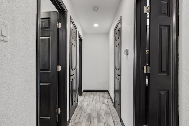 hallway featuring light hardwood / wood-style floors