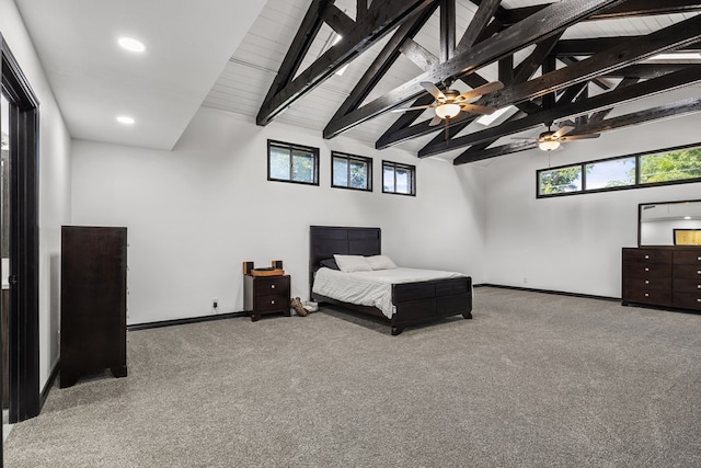 bedroom with carpet floors and multiple windows