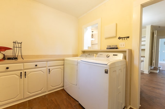 laundry area with cabinets, independent washer and dryer, ornamental molding, and dark wood-type flooring