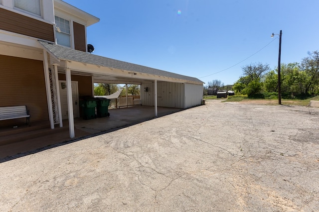 exterior space with a carport