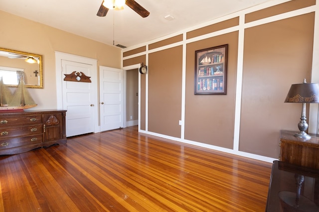 bedroom featuring dark hardwood / wood-style floors and ceiling fan