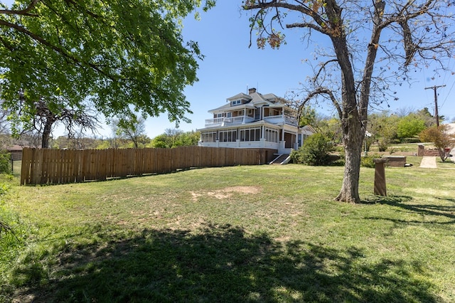 view of yard with a sunroom