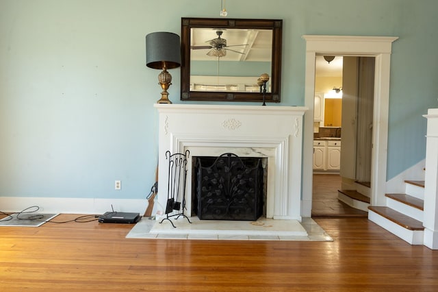 interior details featuring hardwood / wood-style flooring and ceiling fan