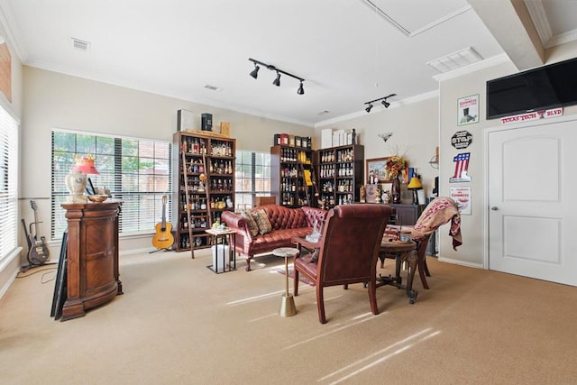 living area featuring carpet floors, plenty of natural light, crown molding, and rail lighting